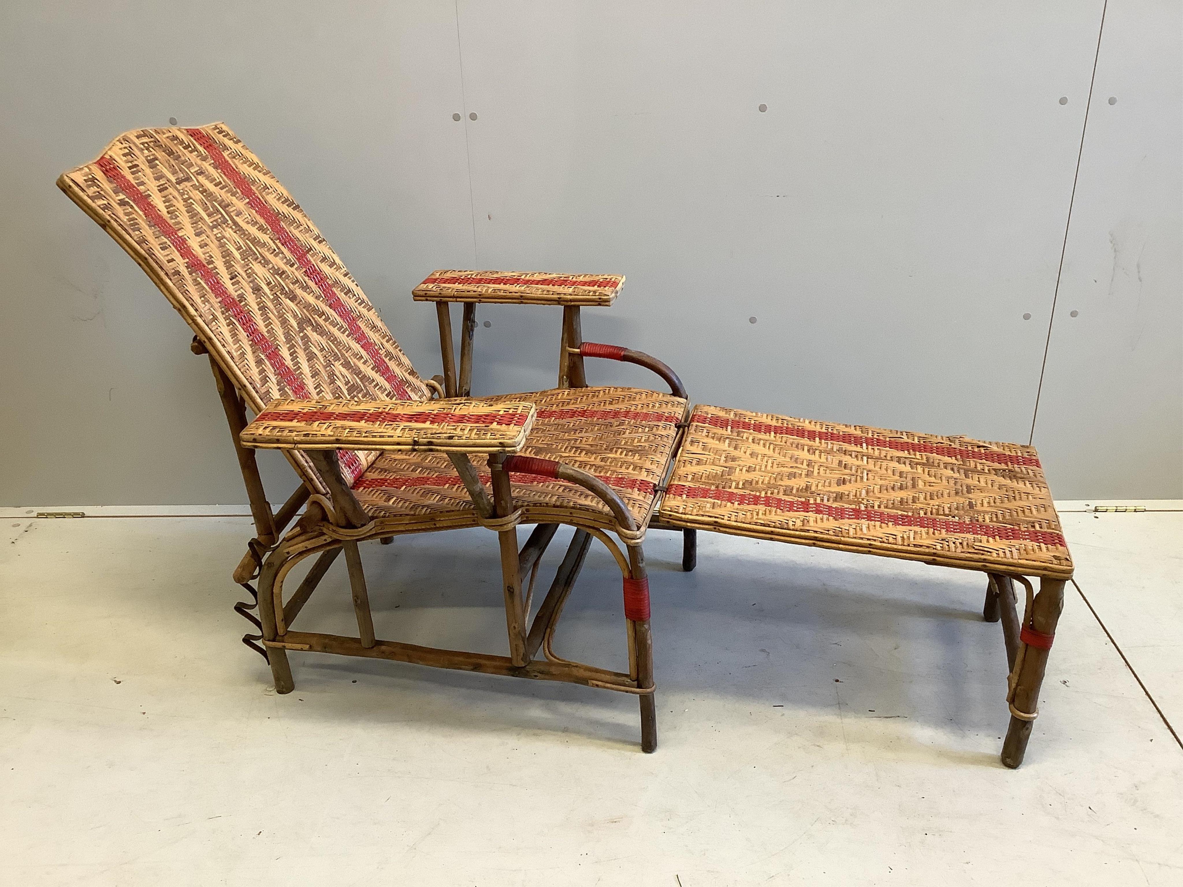A vintage French caned bamboo reclining garden chair with footrest